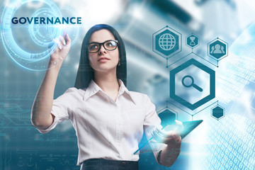 The concept of business, technology, the Internet and the network. A young entrepreneur working on a virtual screen of the future and sees the inscription: Governance