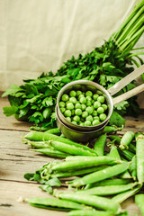 Raw organic green pea on rustic background.Healthy food. Vegetarianism. Clean eating. Making salad ingredients.