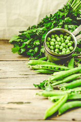 Raw organic green pea on rustic background.Healthy food. Vegetarianism. Clean eating. Making salad ingredients.