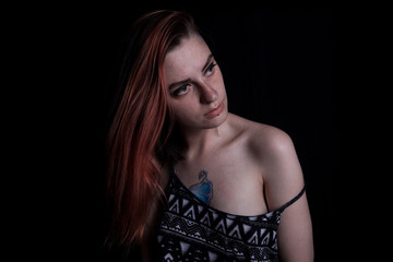 Naklejka premium red hair girl posing in studio