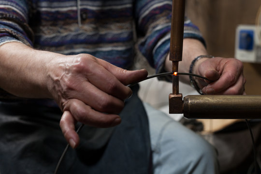 Artisan at Work in his Workshop making lampshades.