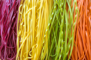 Colored italian pasta made from vegetables. Colourful vegetarian noodles food background. Vegetarian Meals,  vegan food