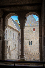 a view through a castle window to the courtyard in Carcossone medieval city