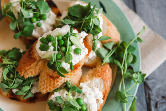 Crostini with spring vegetables and ricotta.