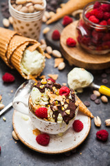 Pistachio ice cream with chocolate and raspberries
