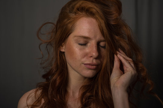 sensual portrait of a redheaded beautiful woman