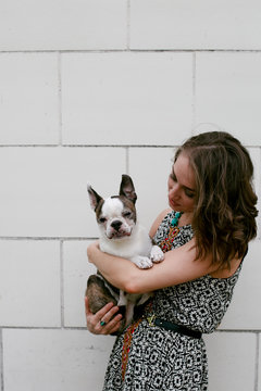 Woman holding dog