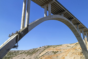 Renewing corrosion damages on arch and pillars of concrete bridge Maslenica on A1 highway in Croatia