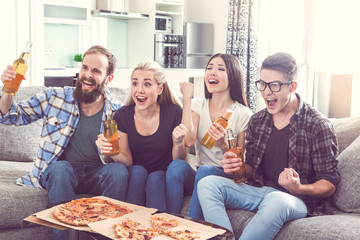 Group of friends having party together at home