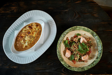 scrambled eggs with mushrooms and vegetables in a frying