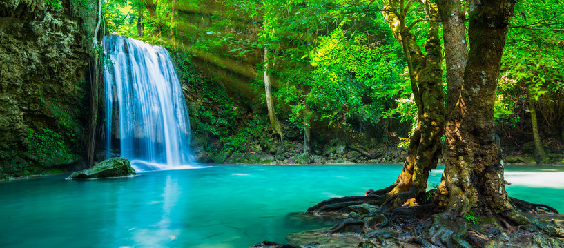 The beautiful waterfall at deep tropical rain forest. © calcassa