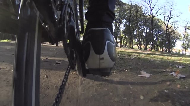 Bicycle Road / MTB /Low angle POV point of view of chain sprocket peddling on road, street, city, traffic - messenger
