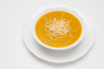 Plate of pea soup served with cheese