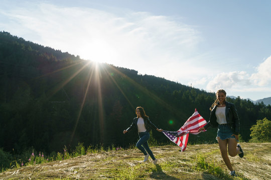Women running with flag