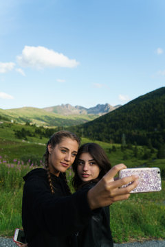 Women taking selfie on meadow
