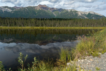 Alaskan Lake with snowless mountain in background