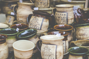 Artistic ceramic bowls as a souvenir at local traditional market in Poland.