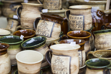 Artistic ceramic bowls as a souvenir at local traditional market in Poland.