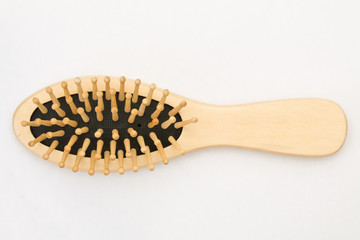 Wooden hairbrush on white background