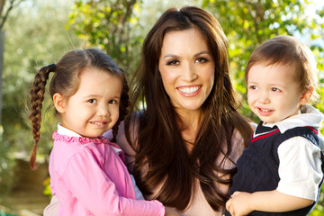 Beautiful Hispanic mother with her childern.