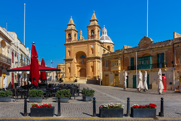 Fototapeta premium Parish Church of Our Lady of Pompei on main square of Mediterranean fishing village Marsaxlokk, Malta
