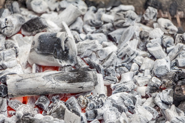 White coal ready for cooking in a barbecue grill