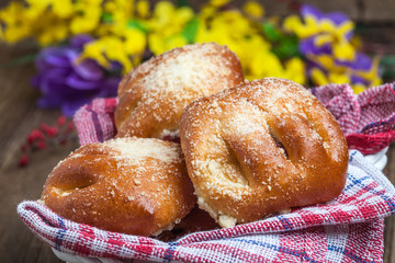 Buns with berries on a wooden table.