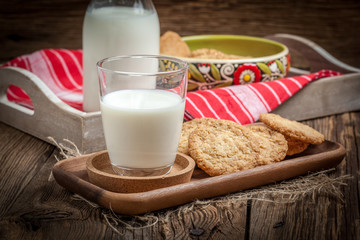 Stack of freshly baked oat biscuits in a bowl.