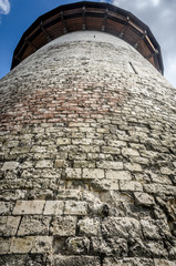 Brick wall wit stones round. Joan of Arc Prison Tower