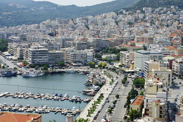 Fototapeta premium Kavala, city in northern Greece, in the Macedonia-Thrace region, located on the Aegean Sea. View of the harbor and a part of the city.