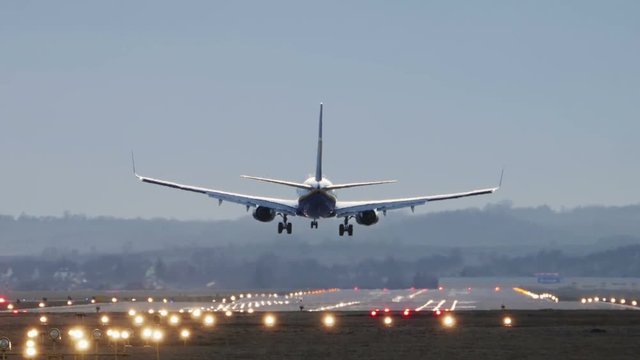 Commercial Airplane Landing in the morning