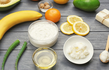 Composition with shea butter and ingredients for homemade cream on table
