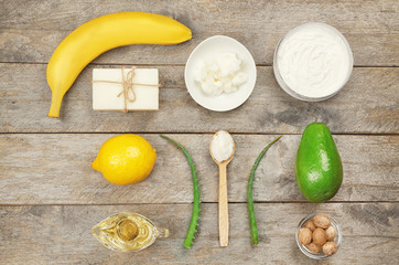 Composition with shea butter and ingredients for homemade cream on table