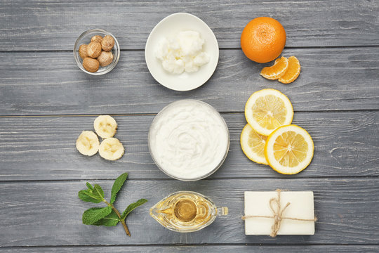 Composition with shea butter and ingredients for homemade cream on table
