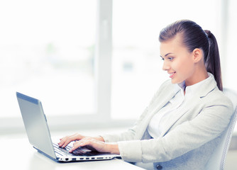 businesswoman with laptop in office