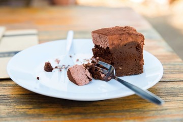 Half of portion of chocolate cake.