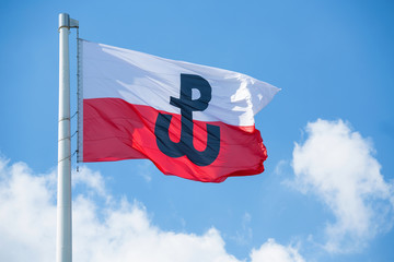 Polish flag with the symbol of Polish Fighting. Symbol of the Warsaw Uprising in 1944