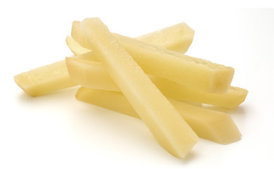 Raw Potato sliced strips prepared for French fries isolated on white background
