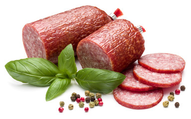 Salami smoked sausage, basil leaves and peppercorns isolated on white background cutout