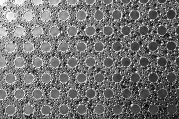 texture of metal circular hole plate and dew drop