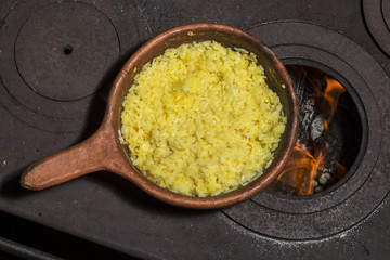 Clay skillet with rice