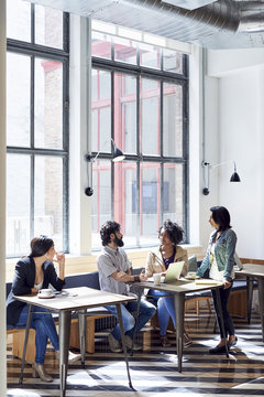 Business People Meeting In Cafe