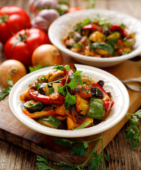 Ratatouille, Vegetable stew made of zucchini, eggplants, peppers, onions, garlic and tomatoes with...