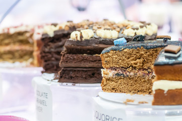Selection of freshly made cakes on display in a restaurant.