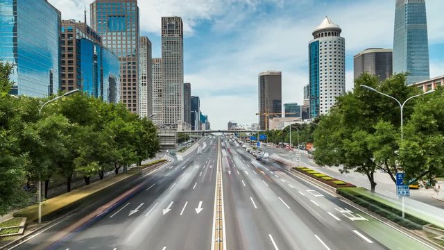 Time lapse of busy traffic and modern buildings in Beijing city , China.