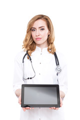 Red haired woman doctor with a tablet computer