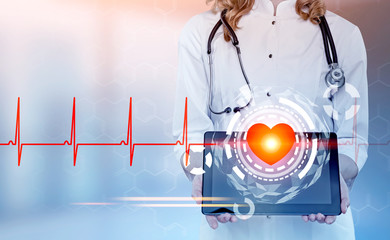 Woman cardiologist with a tablet, heart HUD