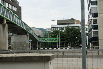 Fototapeta na wymiar bridge on street with cars passing by