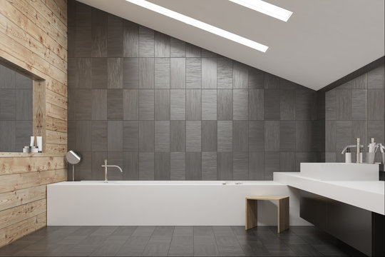 Gray tiled and wooden bathroom