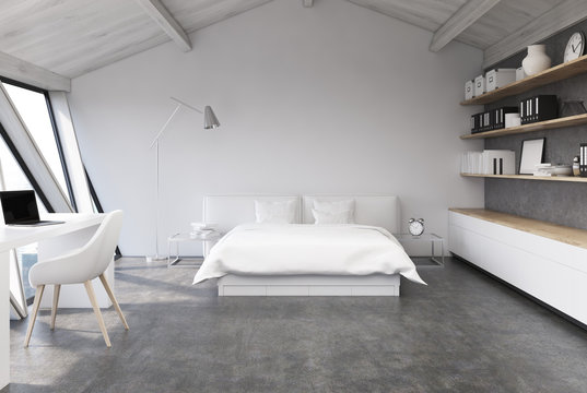 White bedroom in an attic, concrete